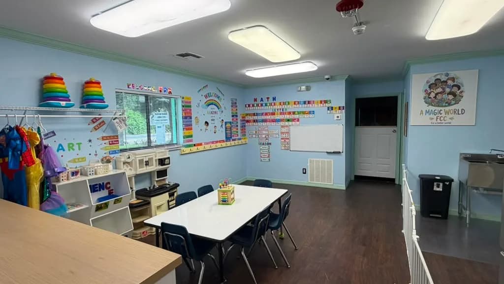 Spacious preschool classroom with activity table, learning walls and dress-up corner at A Magic World Child Care Center in Palm Bay, FL